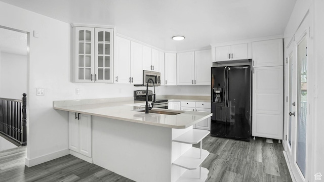 6568 S 5180 W, West Jordan, UT 84081 - kitchen with stainless steel appliances, wood finished floors, glass insert cabinets, white cabinetry, and open shelves