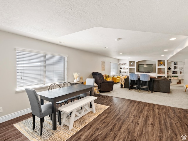 7341 W Sycamore Farm Rd, West Jordan, UT 84081 - dining area featuring a textured ceiling, dark wood-style flooring, built in features, and recessed lighting