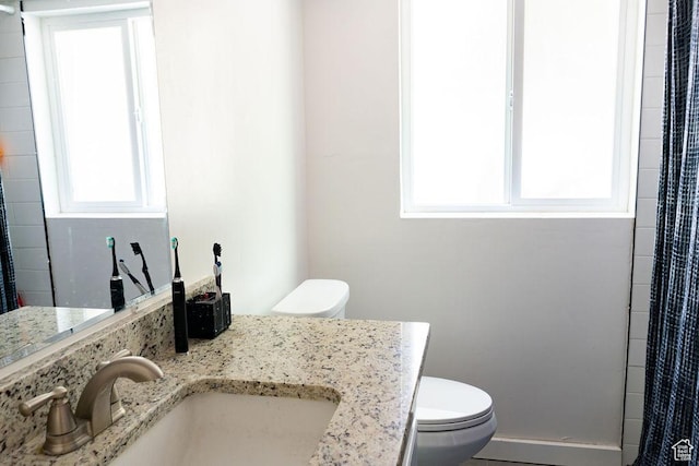1444 S Beacon Dr E, Salt Lake City, UT 84108 - bathroom with healthy amount of natural light, vanity, and a shower with curtain