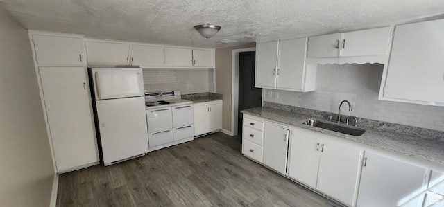 1444 S Beacon Dr E, Salt Lake City, UT 84108 - kitchen featuring white appliances, dark wood finished floors, decorative backsplash, white cabinets, and a textured ceiling
