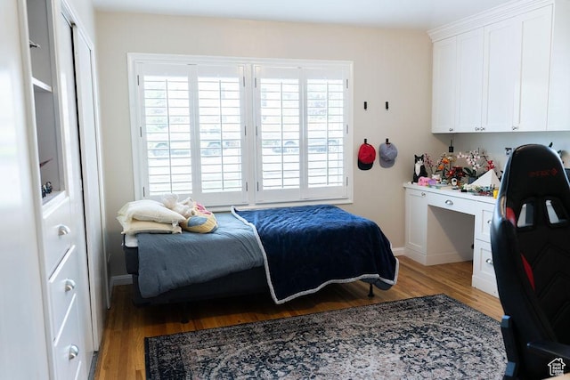 1444 S Beacon Dr E, Salt Lake City, UT 84108 - bedroom with light wood-style flooring and built in study area