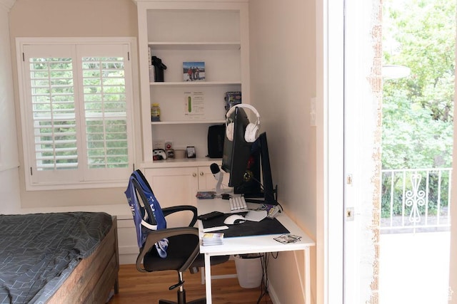1444 S Beacon Dr E, Salt Lake City, UT 84108 - bedroom featuring wood finished floors, a desk, and multiple windows