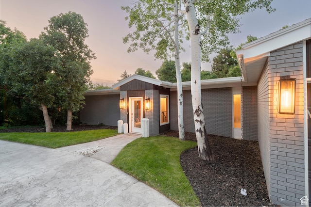 3603 E Macintosh Ln, Cottonwood Heights, UT 84121 - view of front of property featuring brick siding and a yard
