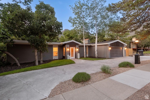 3603 E Macintosh Ln, Cottonwood Heights, UT 84121 - mid-century inspired home featuring brick siding and driveway
