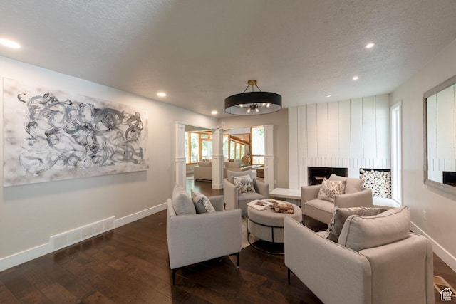 3603 E Macintosh Ln, Cottonwood Heights, UT 84121 - living room featuring hardwood / wood-style flooring, ornate columns, recessed lighting, and a textured ceiling