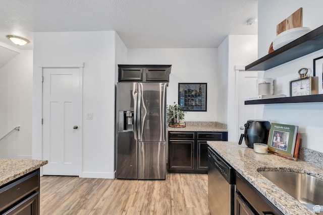 330 N 680 E Unit 330, Vineyard, UT 84059 - kitchen featuring stainless steel appliances, open shelves, light wood-style floors, and light stone counters