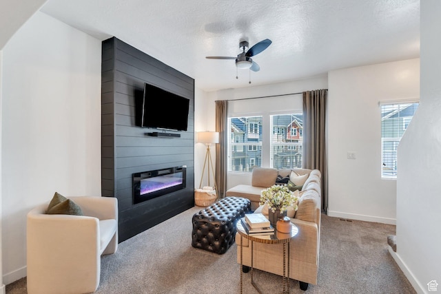 330 N 680 E Unit 330, Vineyard, UT 84059 - carpeted living area with a fireplace, a ceiling fan, healthy amount of natural light, and a textured ceiling