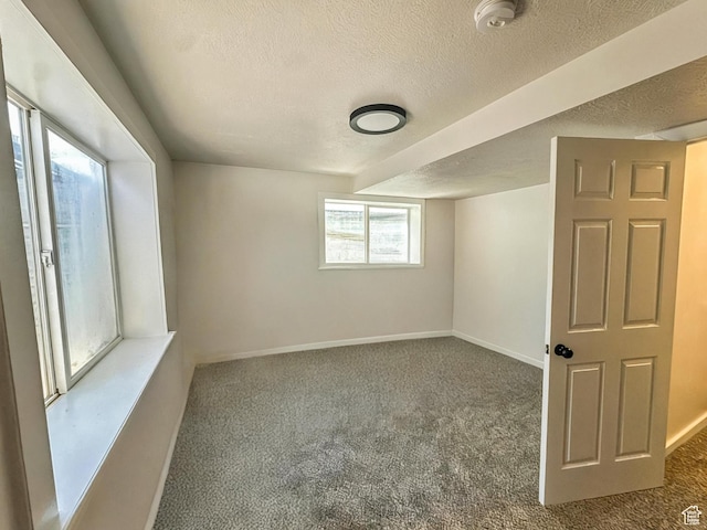 1018 S 810 W, Tooele, UT 84074 - spare room featuring carpet floors, a textured ceiling, and a smoke detector