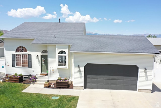 1018 S 810 W, Tooele, UT 84074 - view of front of property featuring concrete driveway, a garage, and a front lawn