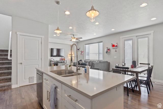 12212 S Sigmon Ln W, Herriman, UT 84096 - kitchen featuring dishwasher, decorative light fixtures, dark wood finished floors, white cabinets, and recessed lighting
