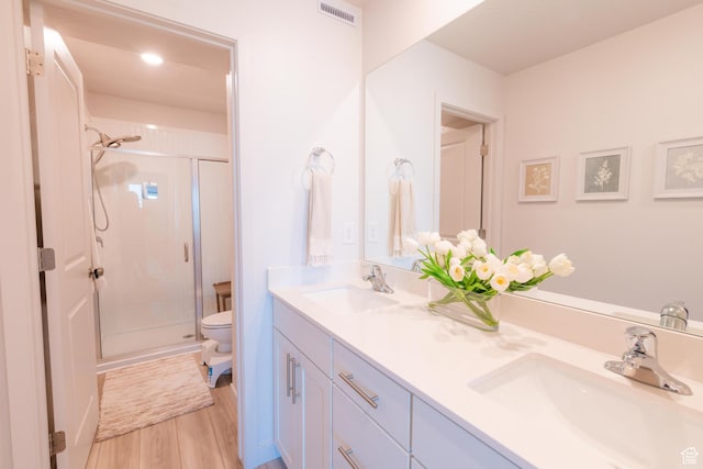 2006 N Red Yearling Dr, Saratoga Springs, UT 84045 - bathroom with a stall shower, double vanity, and wood finished floors