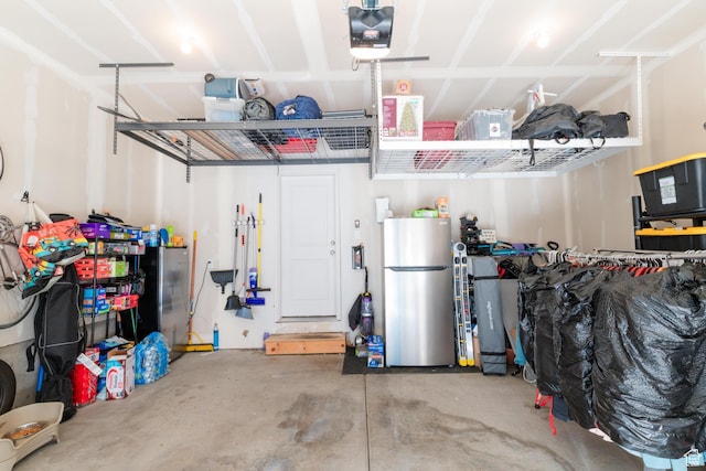 2006 N Red Yearling Dr, Saratoga Springs, UT 84045 - garage with freestanding refrigerator and a garage door opener