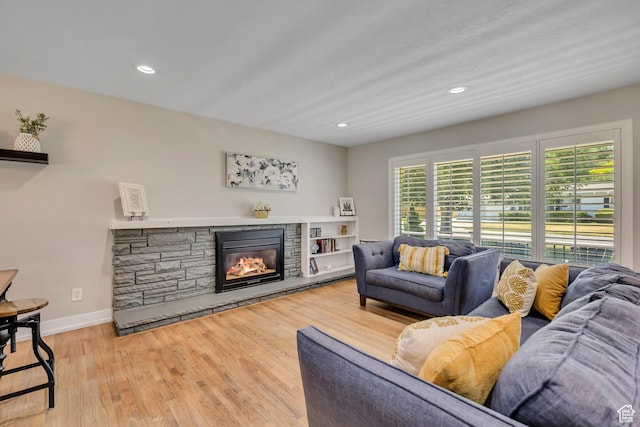 1895 E Brookhill Dr, Cottonwood Heights, UT 84121 - living room featuring wood finished floors, a stone fireplace, and recessed lighting