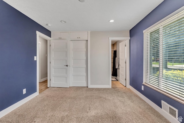 1895 E Brookhill Dr, Cottonwood Heights, UT 84121 - unfurnished bedroom featuring carpet flooring, multiple windows, recessed lighting, and a closet