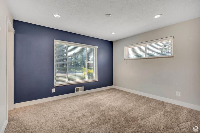 1895 E Brookhill Dr, Cottonwood Heights, UT 84121 - spare room with healthy amount of natural light, carpet floors, recessed lighting, and a textured ceiling