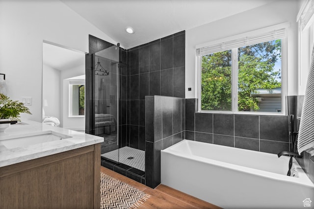 11362 S Mariposa Way E, Sandy, UT 84094 - full bathroom with a bath, lofted ceiling, tiled shower, double vanity, and wood finished floors