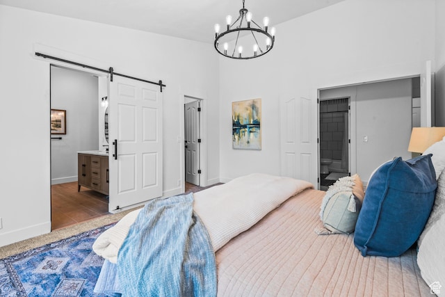 11362 S Mariposa Way E, Sandy, UT 84094 - bedroom with a barn door, ensuite bathroom, and a chandelier