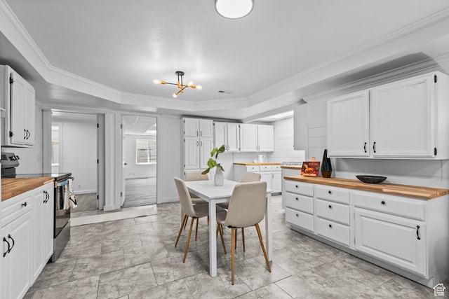 11362 S Mariposa Way E, Sandy, UT 84094 - kitchen with electric range, wooden counters, a chandelier, white cabinets, and ornamental molding