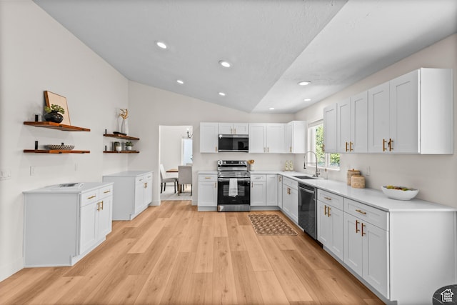 11362 S Mariposa Way E, Sandy, UT 84094 - kitchen with appliances with stainless steel finishes, open shelves, light wood-style flooring, vaulted ceiling, and light countertops