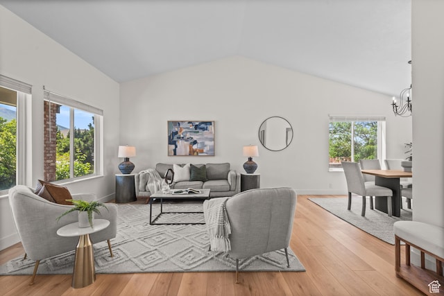 11362 S Mariposa Way E, Sandy, UT 84094 - living room with a chandelier, vaulted ceiling, and wood finished floors