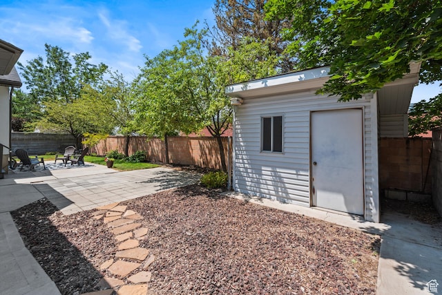 11362 S Mariposa Way E, Sandy, UT 84094 - fenced backyard with a patio and a shed