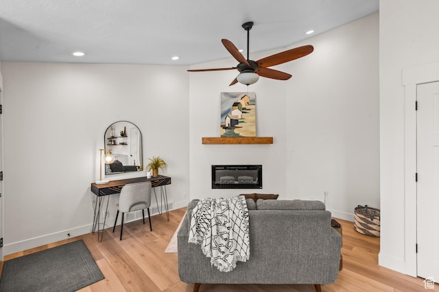11362 S Mariposa Way E, Sandy, UT 84094 - living area featuring a ceiling fan, a glass covered fireplace, light wood-type flooring, and recessed lighting