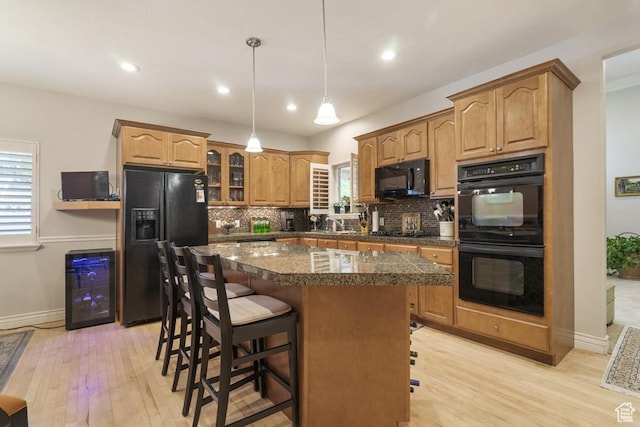 4470 S Snowmass Ct, Millcreek, UT 84124 - kitchen featuring black appliances, beverage cooler, light wood finished floors, tasteful backsplash, and recessed lighting