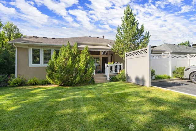 4470 S Snowmass Ct, Millcreek, UT 84124 - rear view of house featuring uncovered parking, a deck, and stucco siding