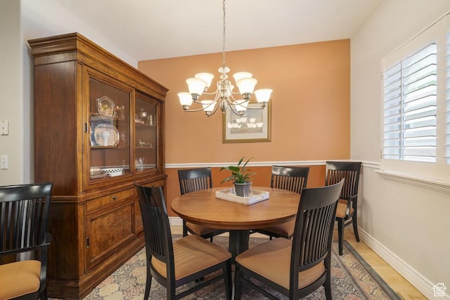 4470 S Snowmass Ct, Millcreek, UT 84124 - dining space featuring a chandelier and light wood-style floors