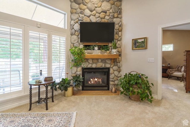 4470 S Snowmass Ct, Millcreek, UT 84124 - carpeted living room featuring a fireplace and baseboards
