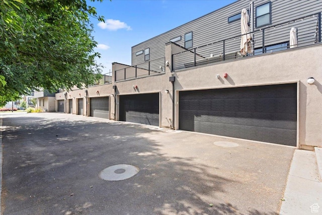 537 S 500 E Unit 106, Salt Lake City, UT 84102 - view of property exterior featuring stucco siding and a balcony