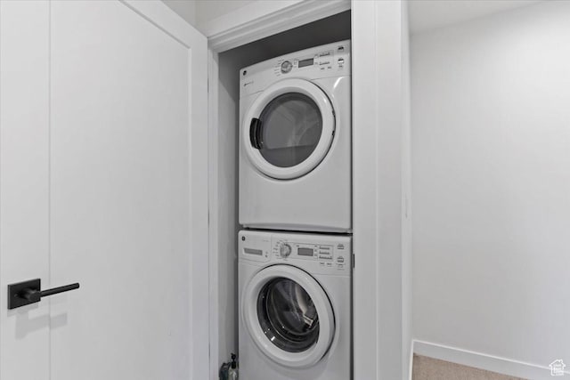 537 S 500 E Unit 106, Salt Lake City, UT 84102 - laundry room with estacked washer and dryer and carpet flooring