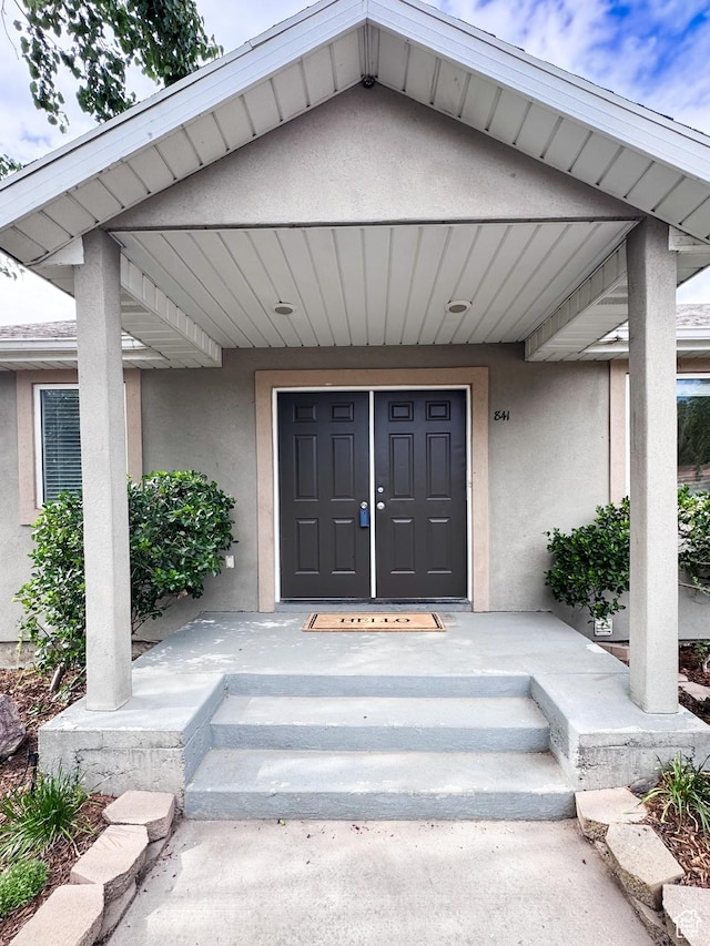 841 E 8600 S, Sandy, UT 84094 - property entrance featuring stucco siding and a porch