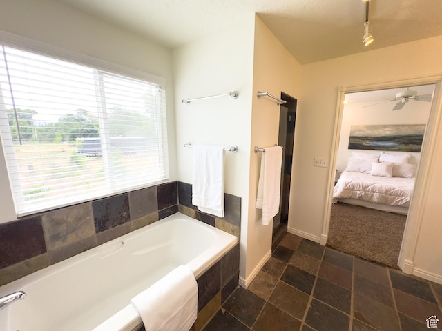 841 E 8600 S, Sandy, UT 84094 - ensuite bathroom with a garden tub, track lighting, and a ceiling fan