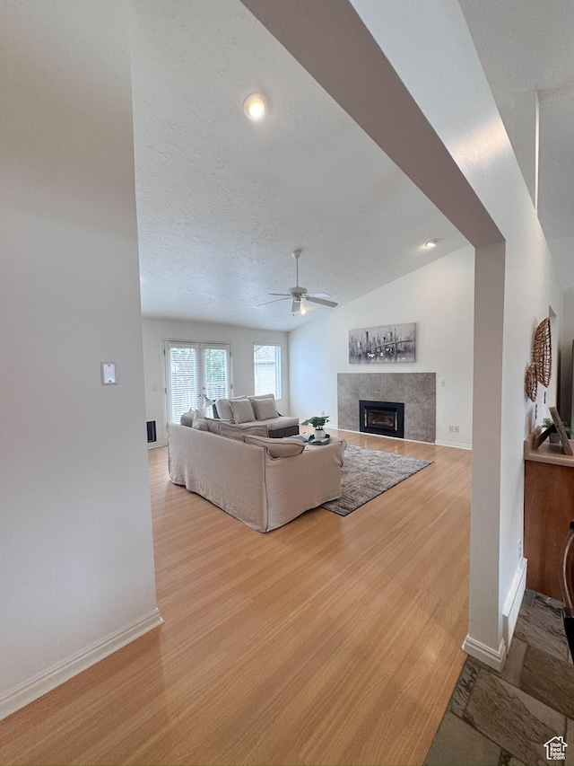841 E 8600 S, Sandy, UT 84094 - living room with a high end fireplace, wood finished floors, and ceiling fan