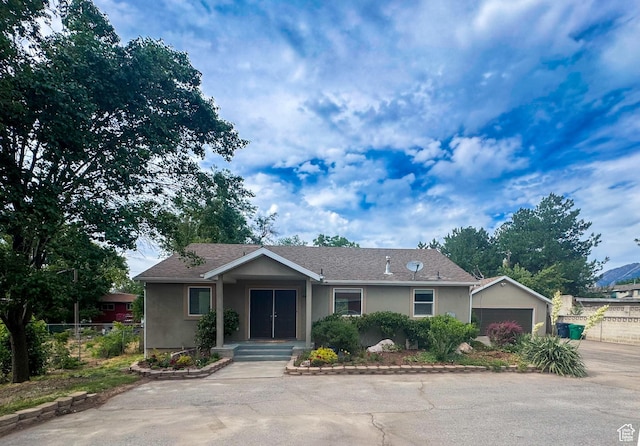 841 E 8600 S, Sandy, UT 84094 - ranch-style home with stucco siding, an attached garage, and an outdoor structure