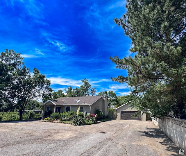 841 E 8600 S, Sandy, UT 84094 - single story home featuring stucco siding, a garage, concrete driveway, and an outdoor structure