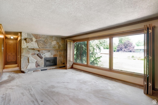 451 S 800 E, Orem, UT 84097 - unfurnished living room with healthy amount of natural light, carpet, a textured ceiling, and a fireplace
