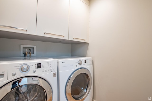 1127 S Denver St S, Salt Lake City, UT 84111 - washroom featuring cabinet space and washer and dryer