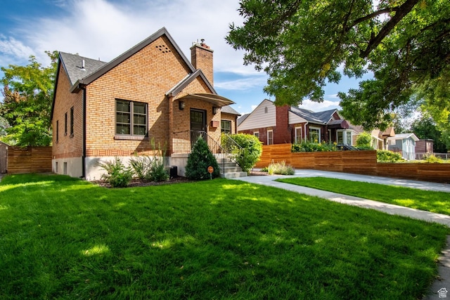 1127 S Denver St S, Salt Lake City, UT 84111 - view of front of house with a chimney and brick siding