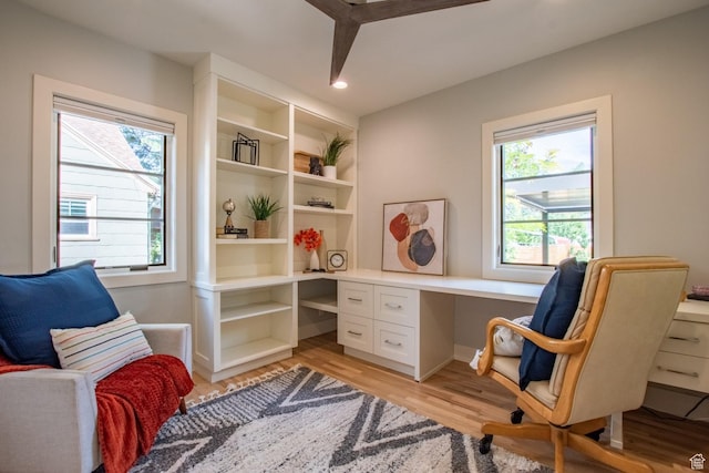 1127 S Denver St S, Salt Lake City, UT 84111 - living area with healthy amount of natural light, light wood-type flooring, built in desk, and recessed lighting