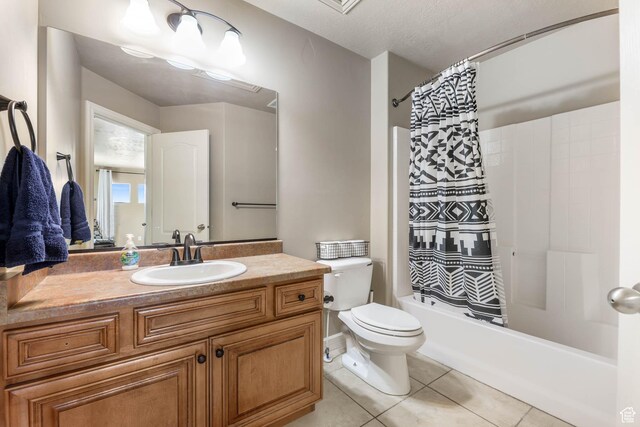 14346 S Fort Duchesne Cv, Herriman, UT 84096 - bathroom featuring vanity, shower / bath combo with shower curtain, and tile patterned floors