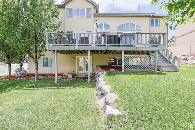 14346 S Fort Duchesne Cv, Herriman, UT 84096 - rear view of house with stucco siding, a wooden deck, and stairs