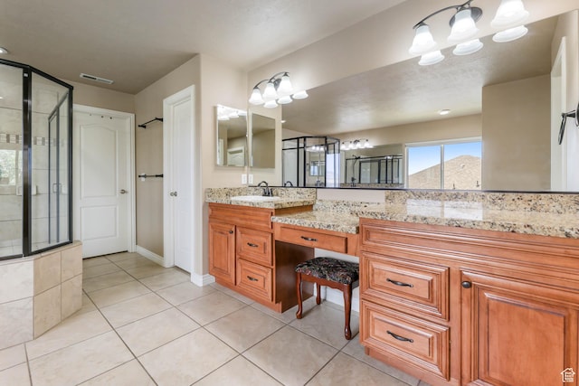 14346 S Fort Duchesne Cv, Herriman, UT 84096 - bathroom with double vanity, tile patterned floors, and an enclosed shower