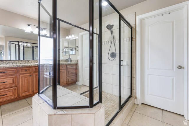 14346 S Fort Duchesne Cv, Herriman, UT 84096 - bathroom with a stall shower, vanity, and tile patterned floors