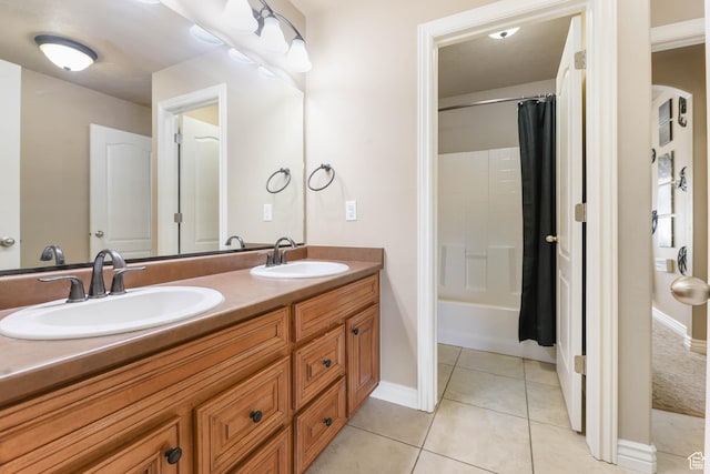 14346 S Fort Duchesne Cv, Herriman, UT 84096 - bathroom with double vanity, tile patterned floors, and shower / bath combination with curtain