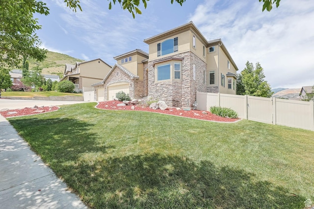14346 S Fort Duchesne Cv, Herriman, UT 84096 - view of front of house with stone siding, stucco siding, and an attached garage