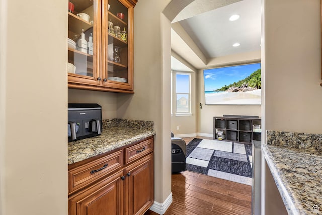 14346 S Fort Duchesne Cv, Herriman, UT 84096 - bar area featuring dark wood-style floors, recessed lighting, and arched walkways