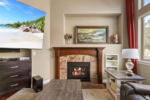 14346 S Fort Duchesne Cv, Herriman, UT 84096 - living area featuring a fireplace, wood finished floors, and healthy amount of natural light