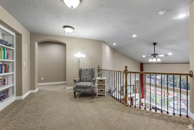14346 S Fort Duchesne Cv, Herriman, UT 84096 - sitting room with ceiling fan, carpet flooring, arched walkways, a textured ceiling, and recessed lighting